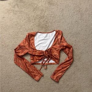 Orange cropped long sleeve top. Never worn